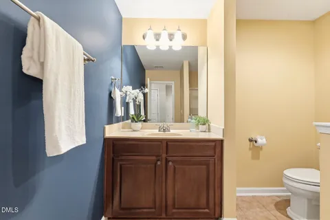 an empty room with fan and fan