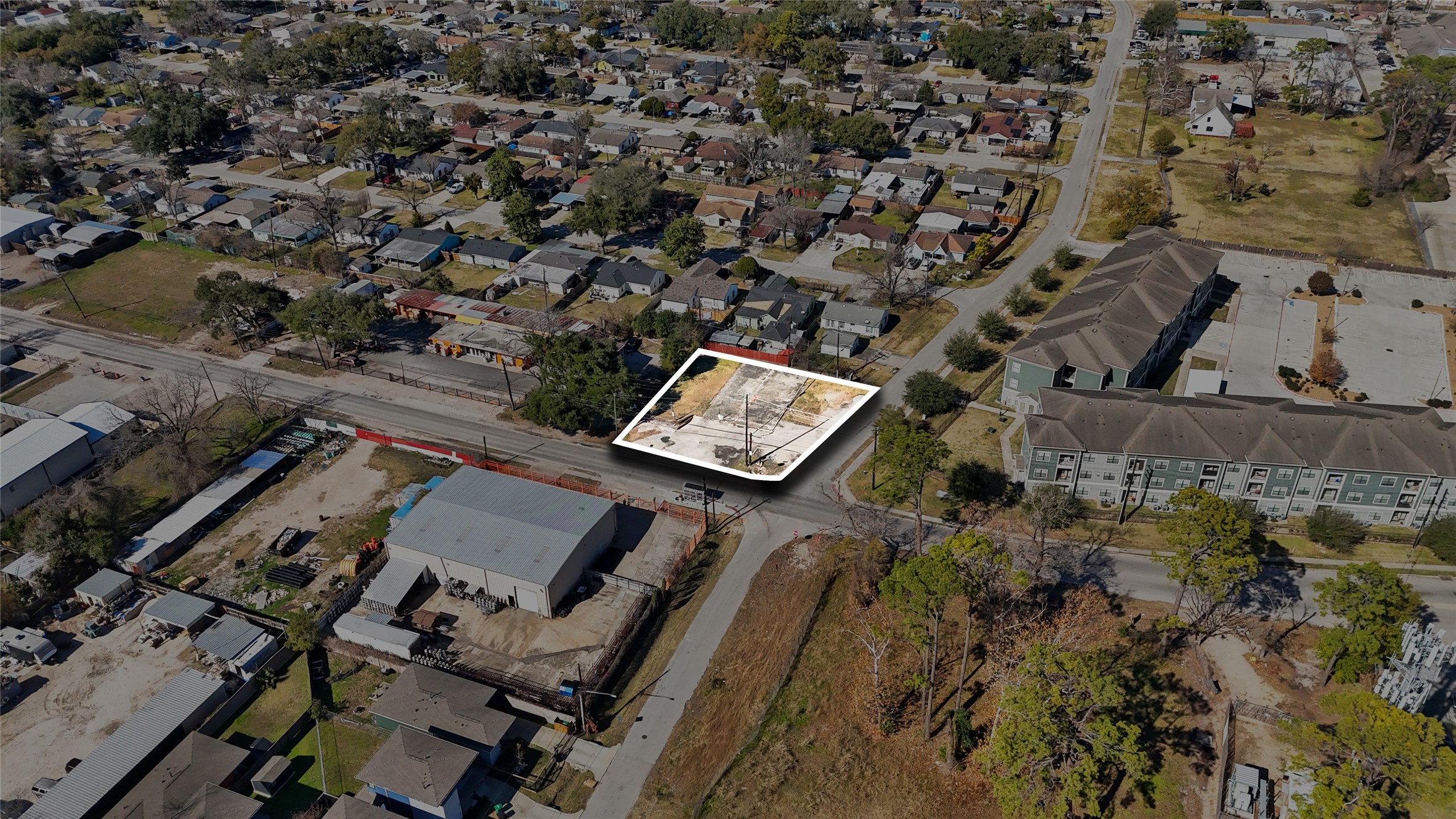 an aerial view of a house with a yard