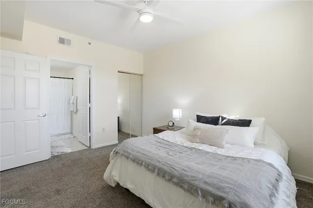 a bedroom with bed and window