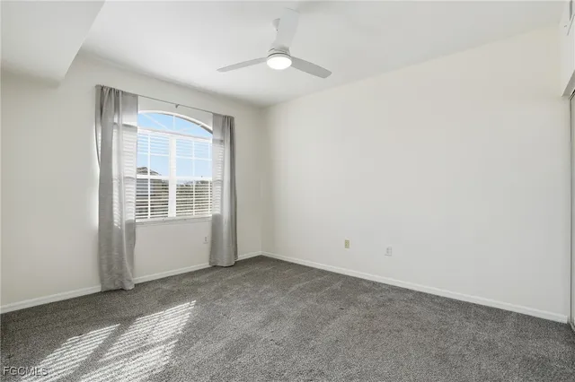 an empty room with closet area