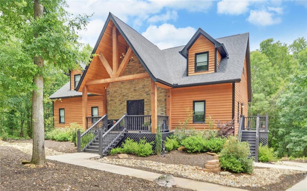 a front view of a house with garden