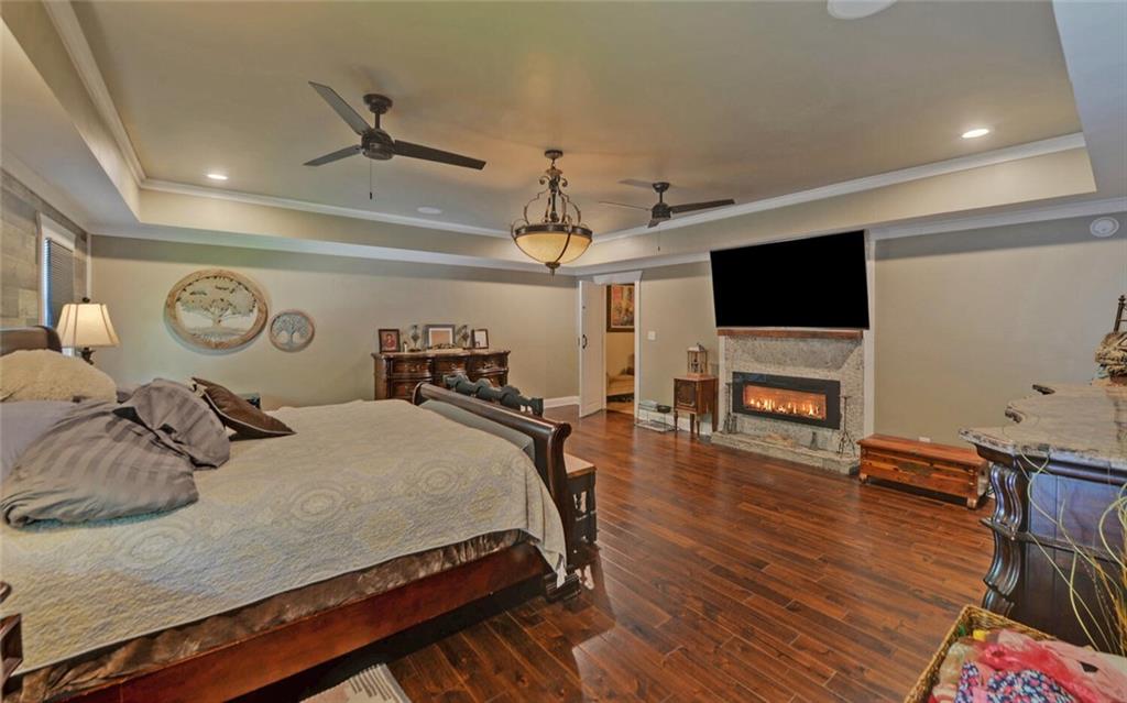 1330 Mc Cannon-Morris Road Colbert, GA 30628 - Photo 20 of 63 a bedroom with a bed and a flat screen tv