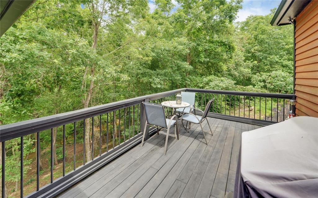 1330 Mc Cannon-Morris Road Colbert, GA 30628 - Photo 30 of 63 a view of a balcony with chairs and wooden floor
