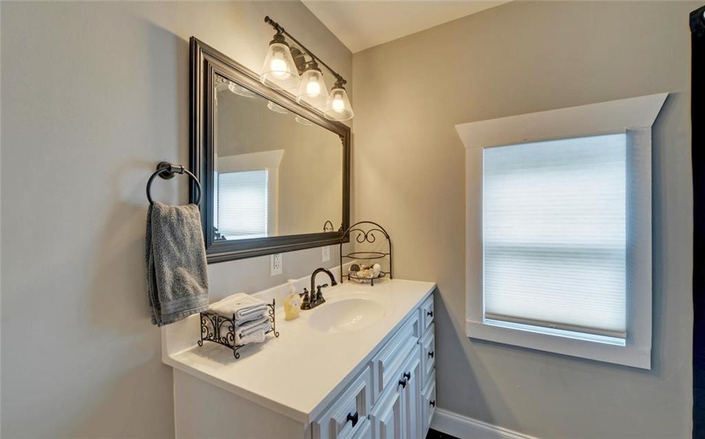 1330 Mc Cannon-Morris Road Colbert, GA 30628 - Photo 38 of 63 a bathroom with a sink vanity and a mirror