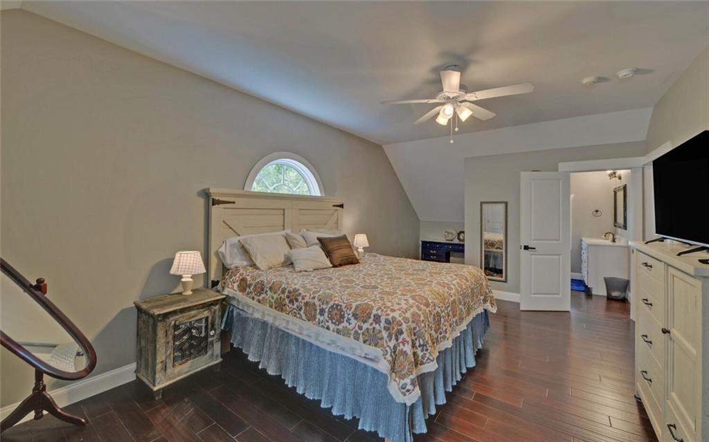 1330 Mc Cannon-Morris Road Colbert, GA 30628 - Photo 40 of 63 a bedroom with a bed and a chandelier