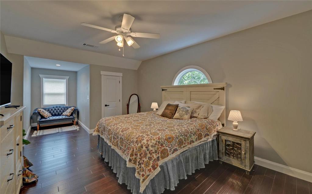 1330 Mc Cannon-Morris Road Colbert, GA 30628 - Photo 41 of 63 a bedroom with a bed and a chandelier