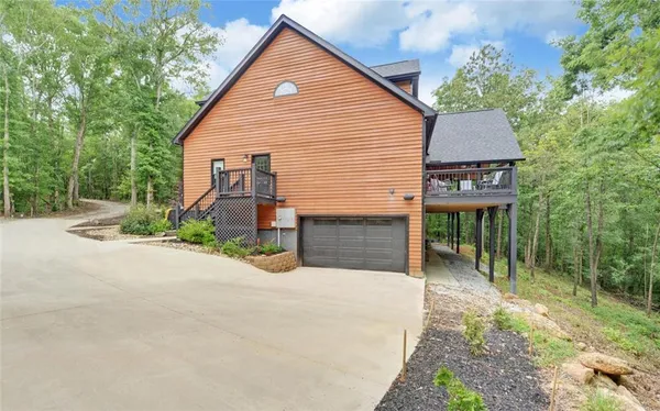 a view of a house with wooden floor and a porch