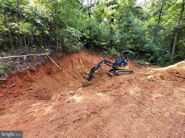a view of outdoor space with trees all around