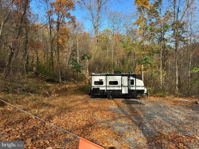 a view of a truck parked in a yard