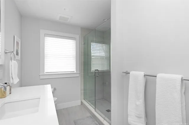 a bathroom with a bathtub and a shower