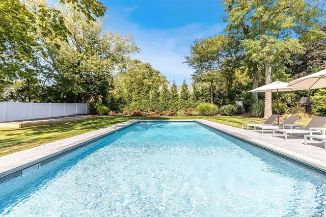 a view of swimming pool with chairs