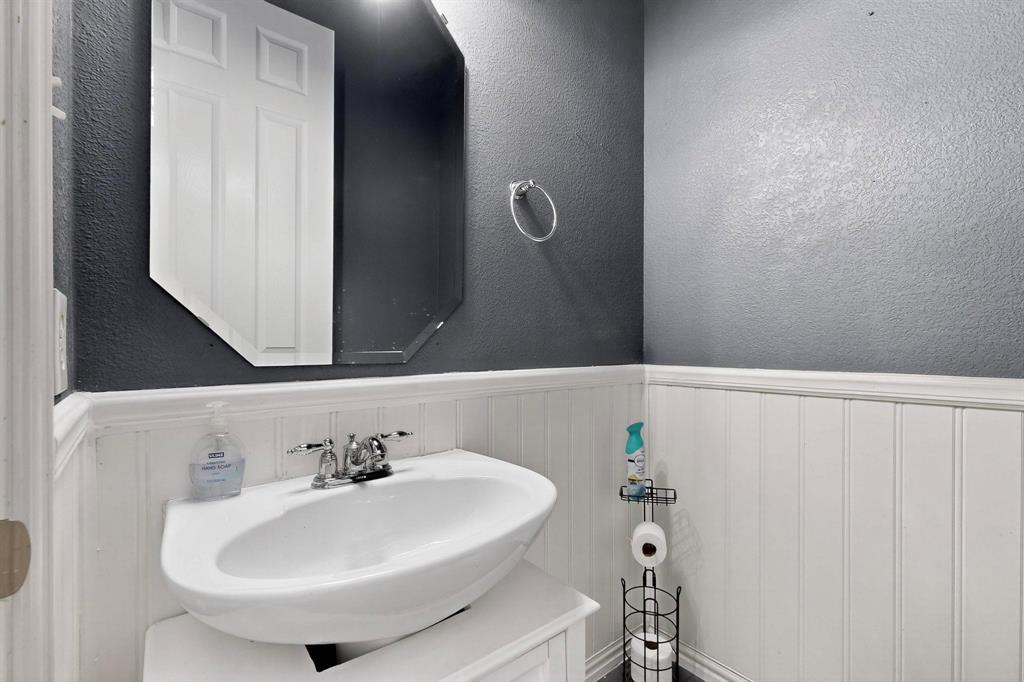 10309 Crowne Pointe Lane Fort Worth, TX 76244 - Photo 13 of 37 a bathroom with a sink and a mirror