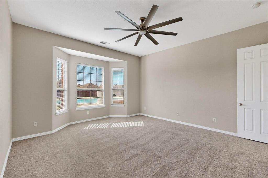 10309 Crowne Pointe Lane Fort Worth, TX 76244 - Photo 16 of 37 a view of a livingroom with a ceiling fan and window