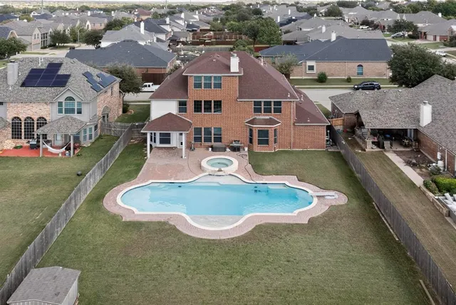 an aerial view of a house with outdoor space