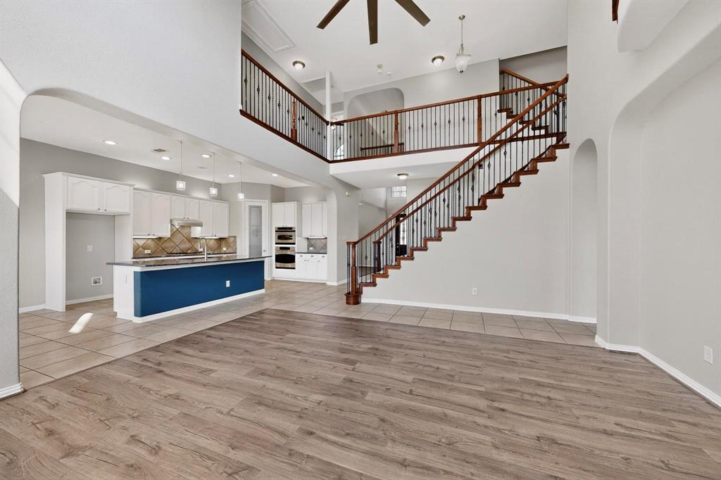 10309 Crowne Pointe Lane Fort Worth, TX 76244 - Photo 10 of 37 a view of kitchen and hall with wooden floor