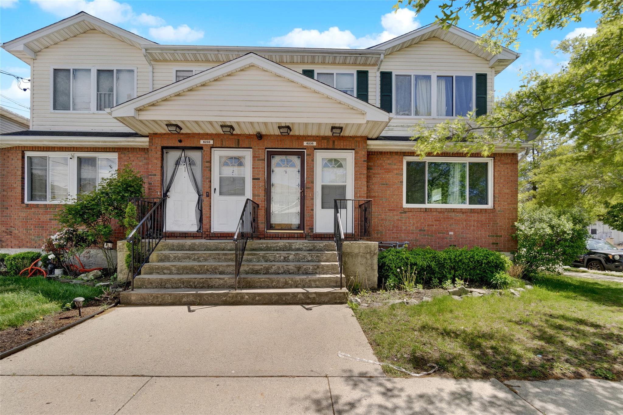 front view of a house with a yard