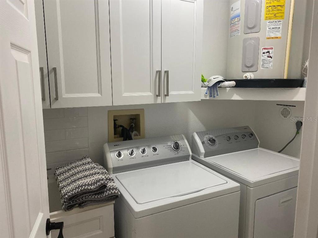 8437 Gibralter Street Spring Hill, FL 34608 - Photo 19 of 30 a utility room with dryer and washer