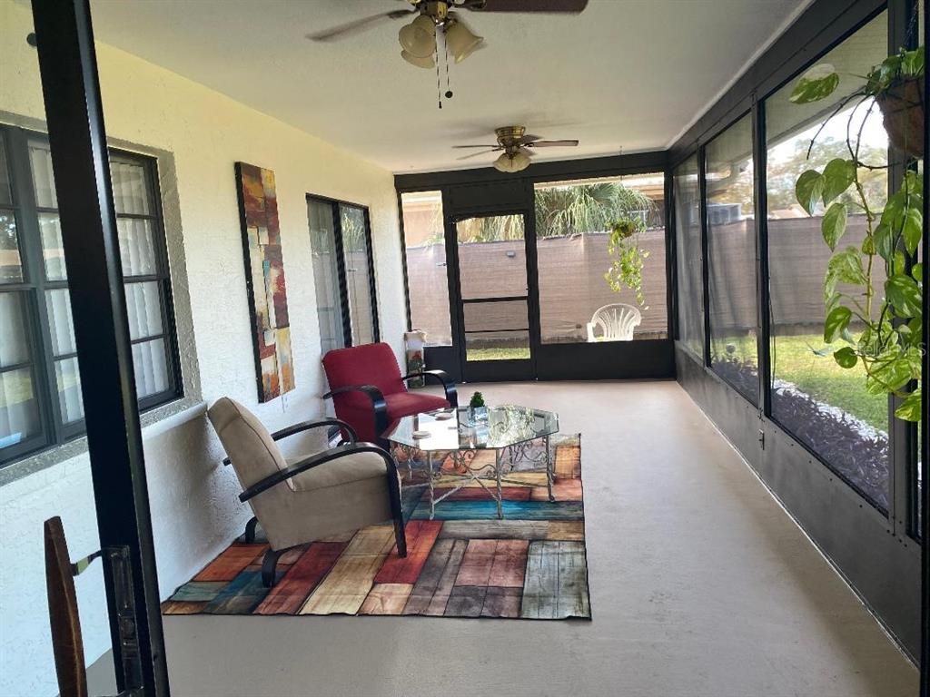 8437 Gibralter Street Spring Hill, FL 34608 - Photo 24 of 30 a living room with furniture and a large window