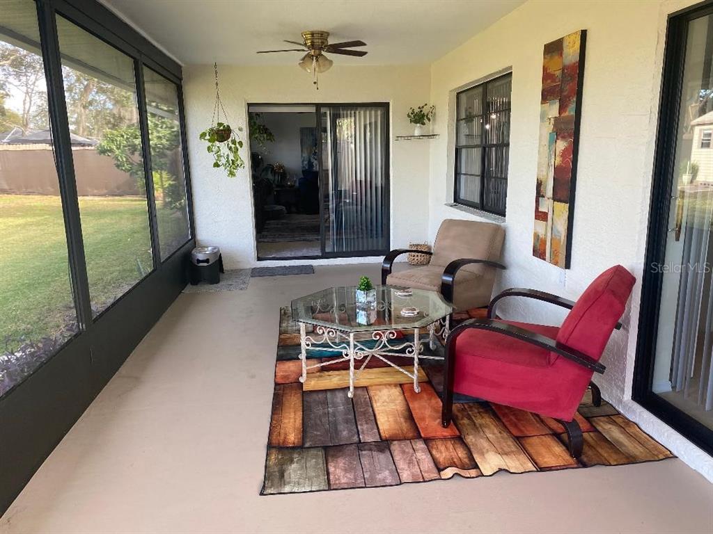 8437 Gibralter Street Spring Hill, FL 34608 - Photo 25 of 30 a living room with furniture and a large window