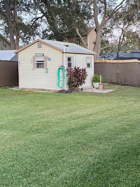 8437 Gibralter Street Spring Hill, FL 34608 - Photo 29 of 30 a view of a house with a yard