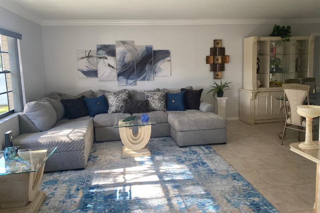 8437 Gibralter Street Spring Hill, FL 34608 - Photo 6 of 30 a living room with furniture and a window