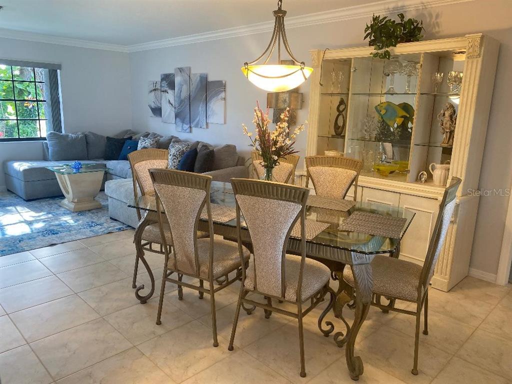 8437 Gibralter Street Spring Hill, FL 34608 - Photo 9 of 30 a view of a dining room with furniture and window