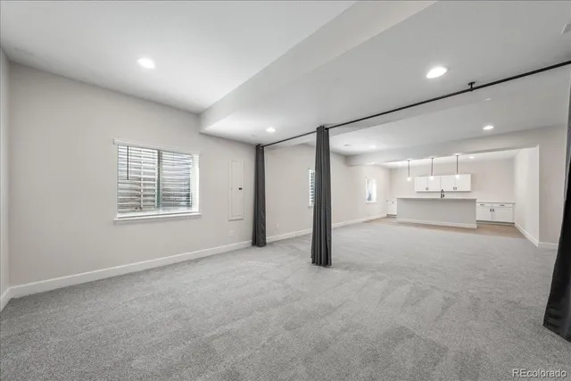 a view of a kitchen with a sink and cabinets