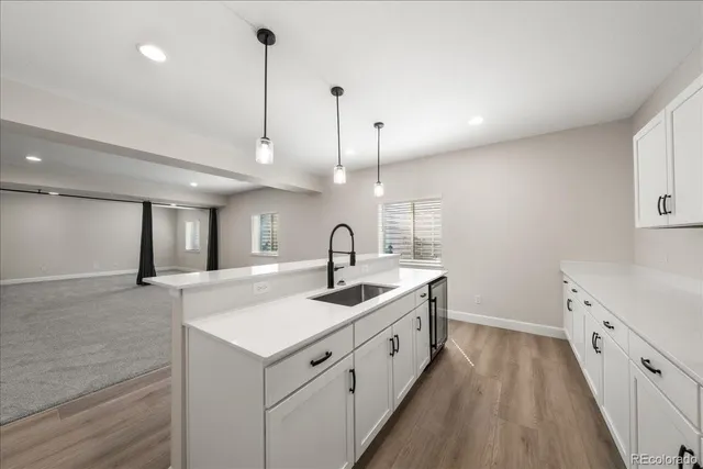 a bathroom with a toilet a sink and a large mirror