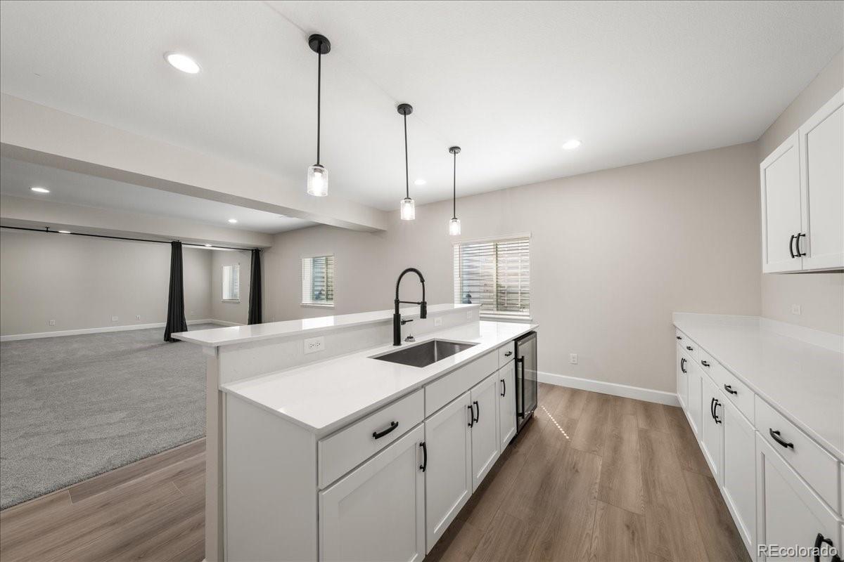 1335 Alyssa Drive Timnath, CO 80547 - Photo 42 of 50 a kitchen with sink stove and cabinets