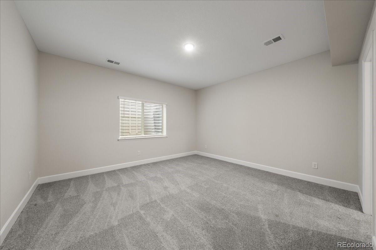1335 Alyssa Drive Timnath, CO 80547 - Photo 44 of 50 a view of an empty room with a window