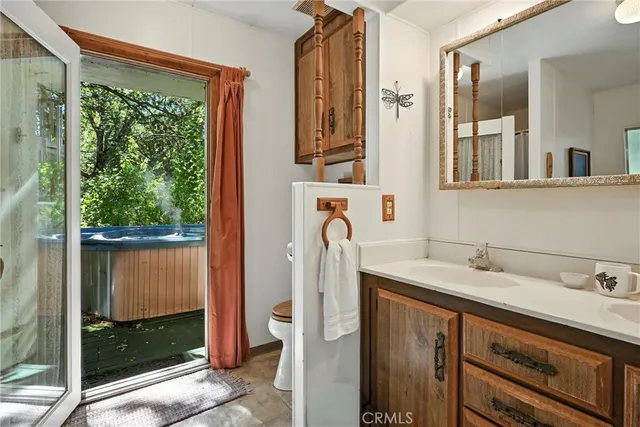a bathroom with a sink a mirror and shower