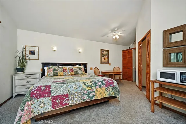 a bedroom with a bed furniture and a window