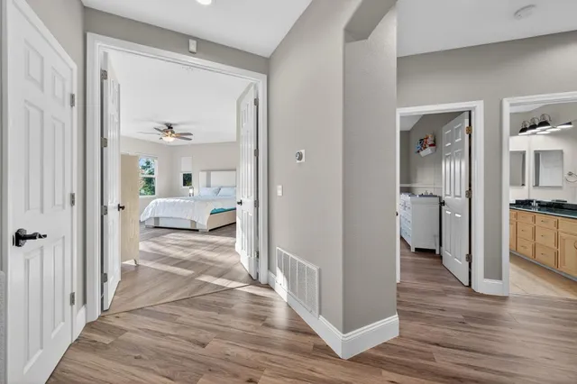 a view of a bedroom from a hallway