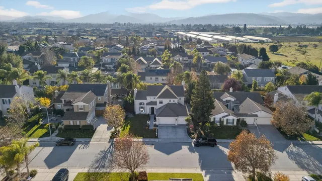 an aerial view of a house with outdoor space