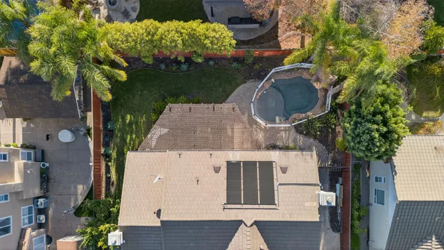 an aerial view of residential houses with outdoor space