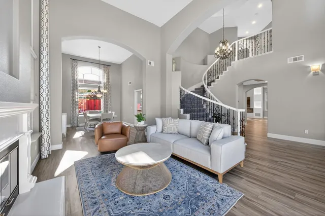 a living room with furniture and a table