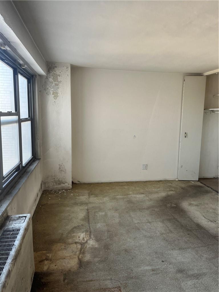 1020 Grand Concourse, Unit 8H Bronx, NY 10451 - Photo 5 of 13 Empty room with a healthy amount of sunlight