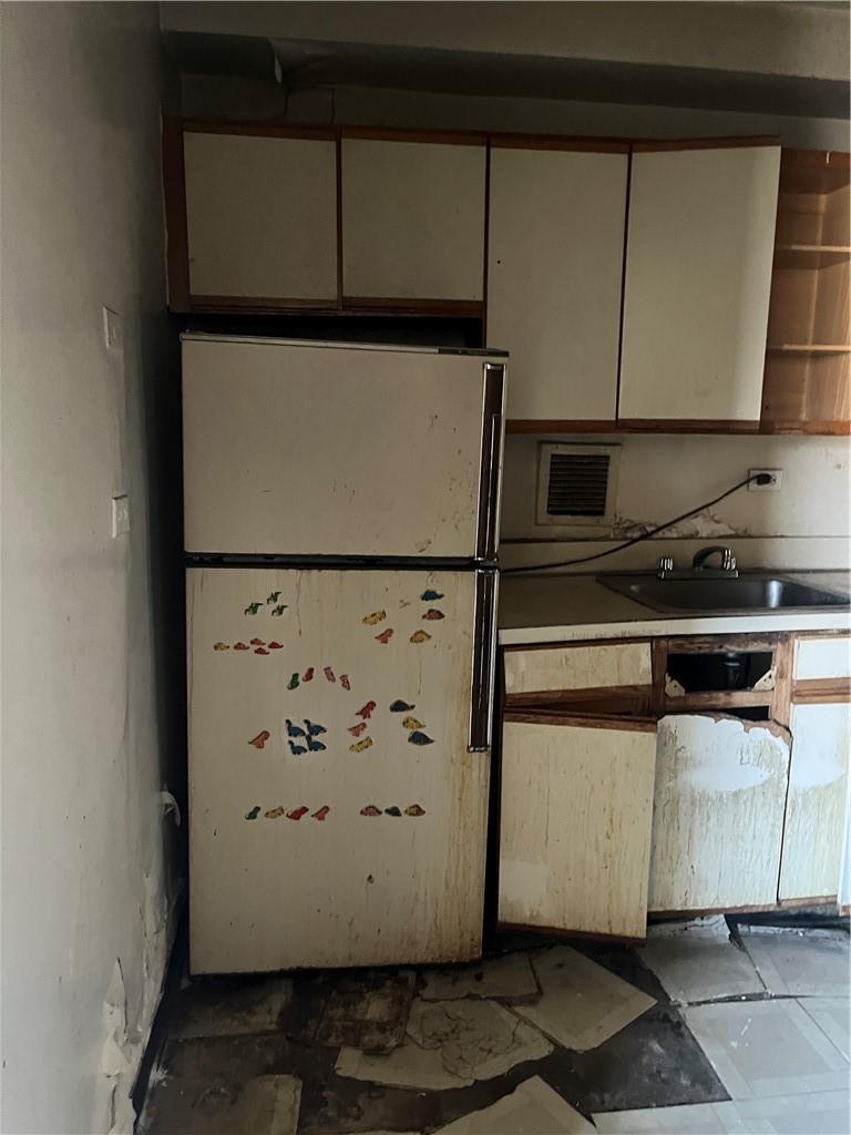 1020 Grand Concourse, Unit 8H Bronx, NY 10451 - Photo 7 of 13 Kitchen featuring sink and fridge