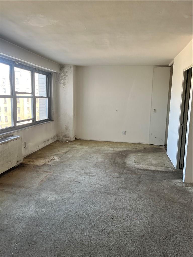 1020 Grand Concourse, Unit 8H Bronx, NY 10451 - Photo 9 of 13 Spare room featuring carpet floors