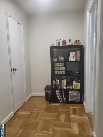 a view of a hallway with seating area