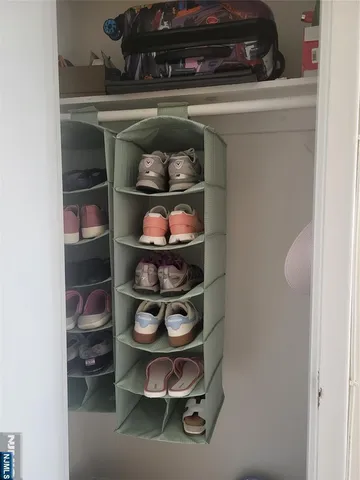 a shelf with cup and plates