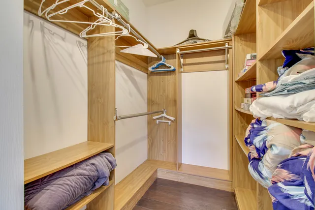 a bedroom with bed and window