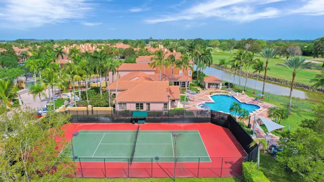 an aerial view of residential houses with outdoor space and street view