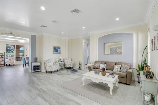 an aerial view of residential houses with outdoor space and pool
