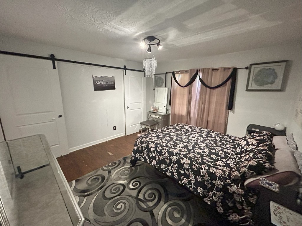 319 Walnut Avenue Winnie, TX 77665 - Photo 11 of 19 a bed room with a bed and a window