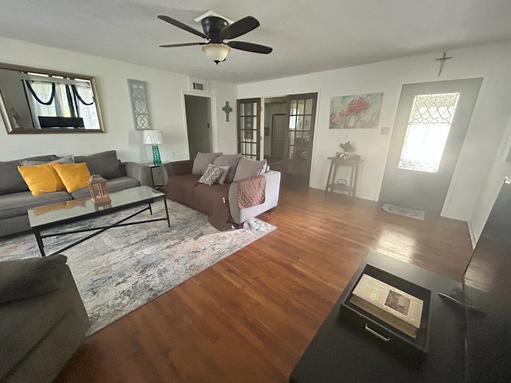 319 Walnut Avenue Winnie, TX 77665 - Photo 3 of 19 a living room with furniture and a wooden floor
