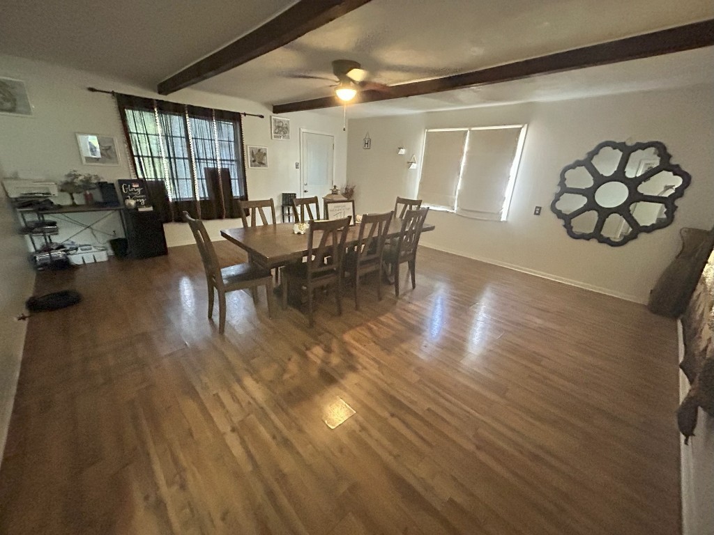 319 Walnut Avenue Winnie, TX 77665 - Photo 7 of 19 a view of a dining room with furniture window and wooden floor
