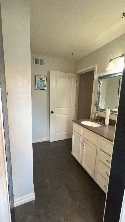 319 Walnut Avenue Winnie, TX 77665 - Photo 8 of 19 a bathroom with a double vanity sink a mirror and a shower