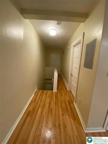 a view of wooden floor in a bathroom