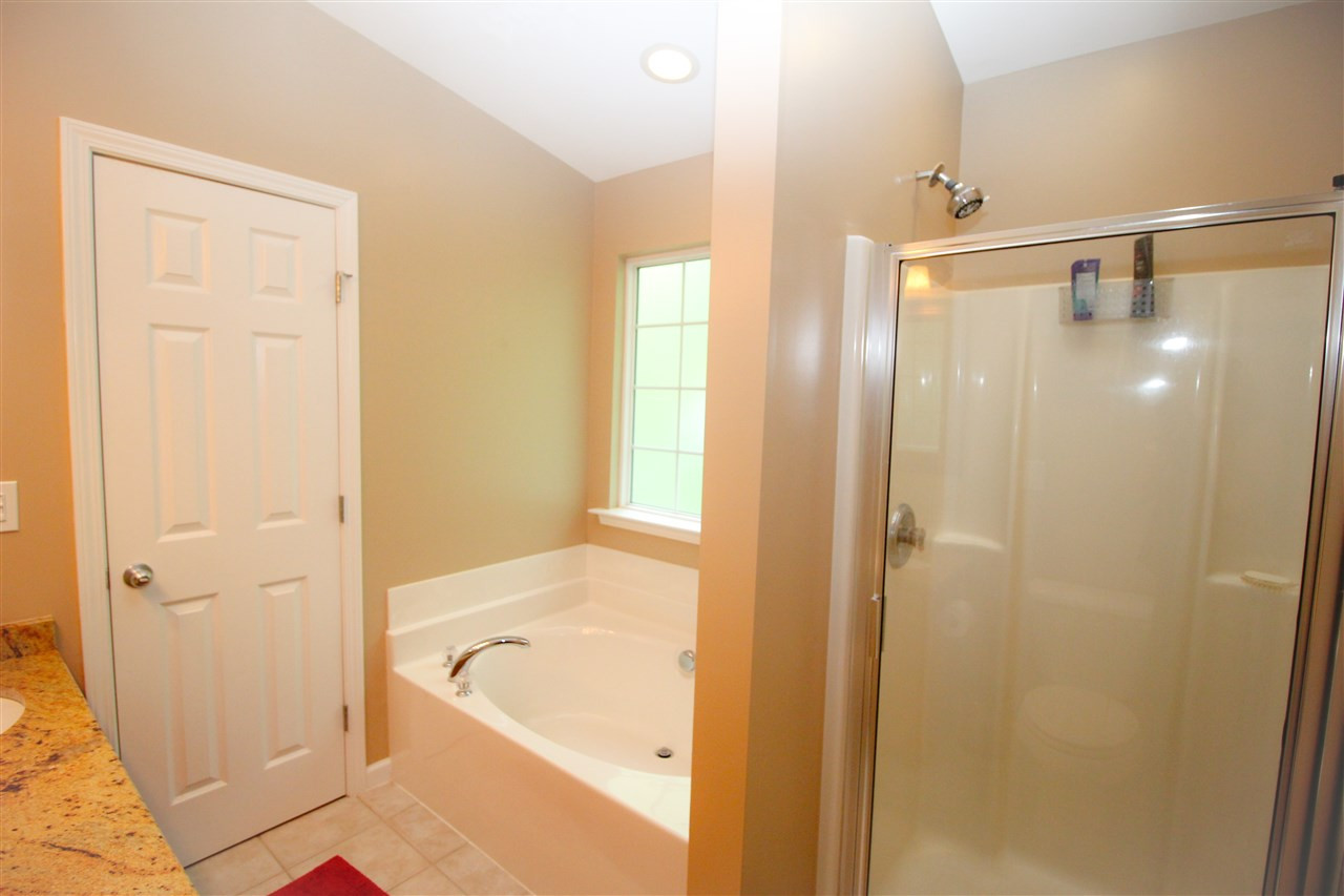 201 Riley Oaks Lane Apex, NC 27539 - Photo 18 of 29 Enjoy the best of both worlds with a walk-in shower and large, separate garden tub in the master bathroom! Master Bath/Spa